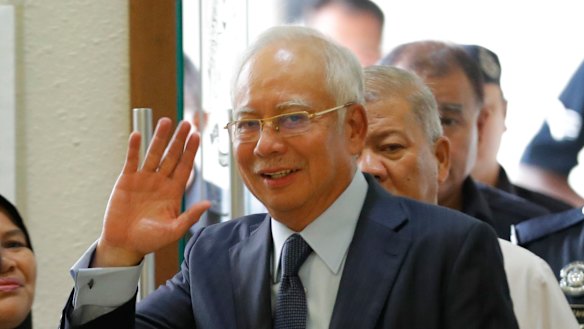 Former Malaysian prime minister Najib Razak walks into a court room at Kuala Lumpur High Court in October. 