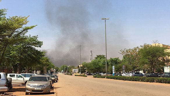 Smoke can be seen rising in the distance from an Islamic extremist attack in 2018.