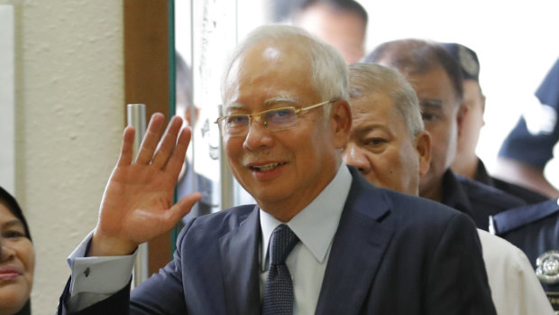 Former Malaysian prime minister Najib Razak walks into a court room at Kuala Lumpur High Court in October. 