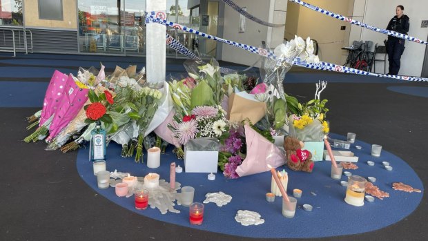 Flowers and tributes left at the Redbank Plains shopping centre where Vyleen White died.