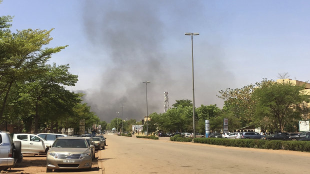 Smoke can be seen rising in the distance from an Islamic extremist attack in 2018.