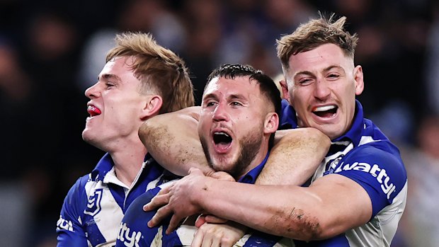 Happy dogs: Bronson Xerri celebrates a try.