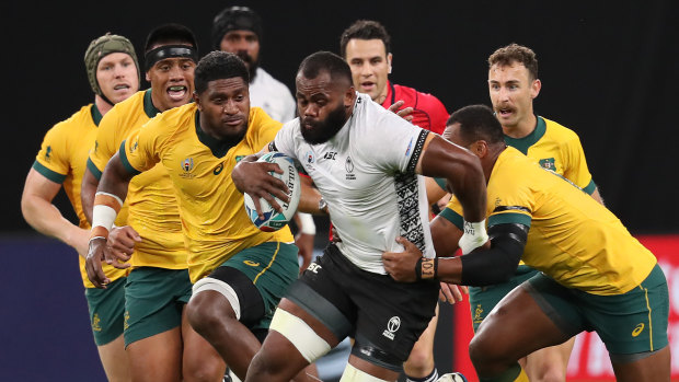 Raw power: Fiji's Peceli Yato tries to split the Wallabies' defence.