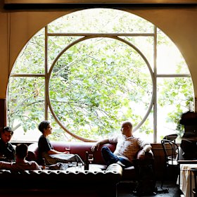 The iconic half-moon window and Chesterfield couches.