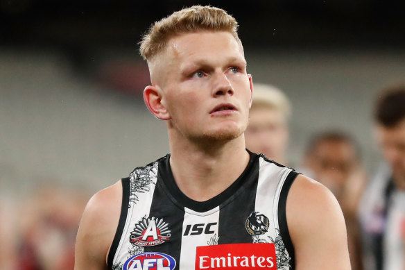 Adam Treloar's trade saga has ended with a move to the Bulldogs. 