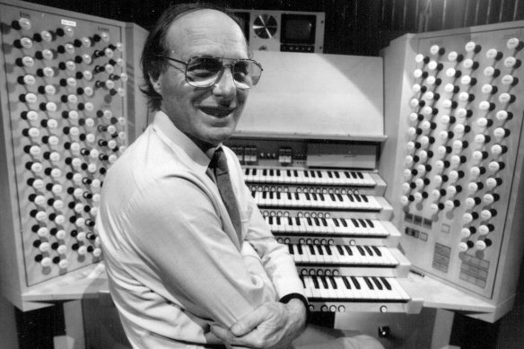 Ron Sharp pictured with the Opera House organ he designed and built, 1993.