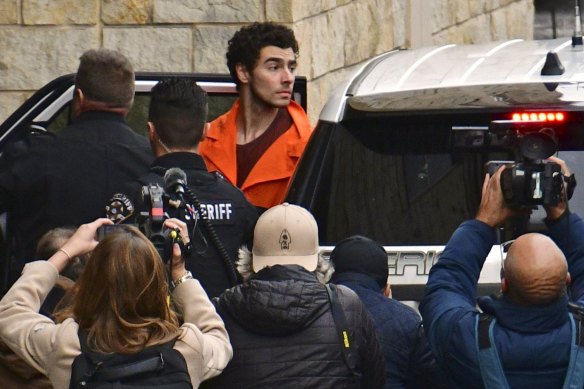 Murder suspect Luigi Mangione is taken into the Blair County Courthouse.