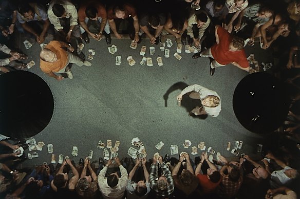 A still from Wake in Fright (1971). The protoganist, a young schoolteacher played by Gary Bond, loses his money in a two-up game and is stranded in a town loosely based on Broken Hill, NSW.