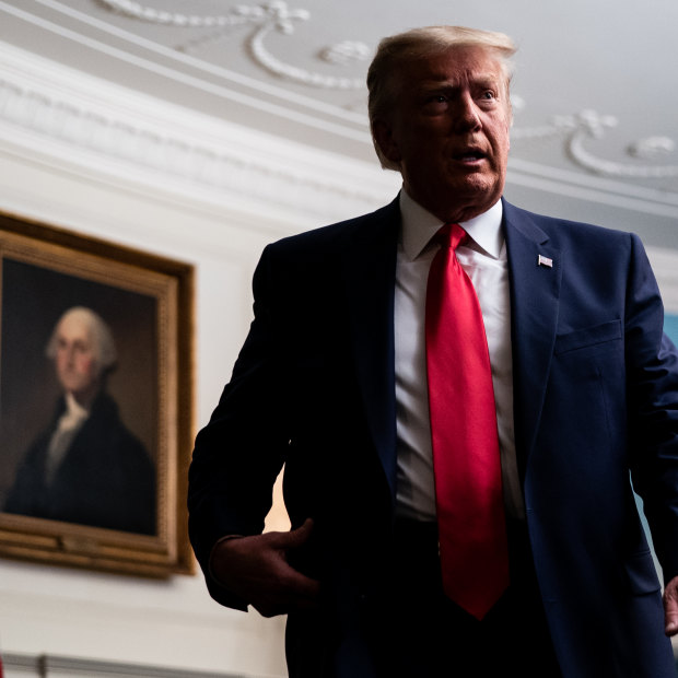 US President Donald Trump departs after holding a videoconference with members of the military in the Diplomatic Room of the White House on Thursday, November 26.