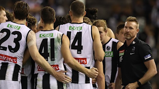 Magpies coach Nathan Buckley talks to his players during Saturday night’s clash.