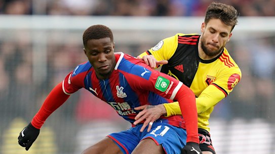 Crystal Palace's Wilfried Zaha, left, has made his portfolio of 50 rental homes available to Britain's National Health Service staff.