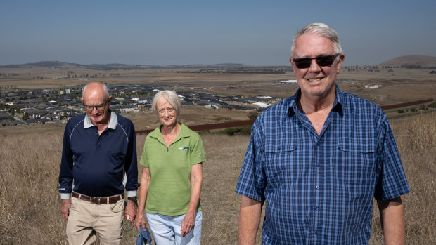 Wallan Environment Group president Norbert Ryan, and former presidents Cr Claudia James and Rob Eldridge on Green Hill, Wallan, with Herne Swamp behind them. 