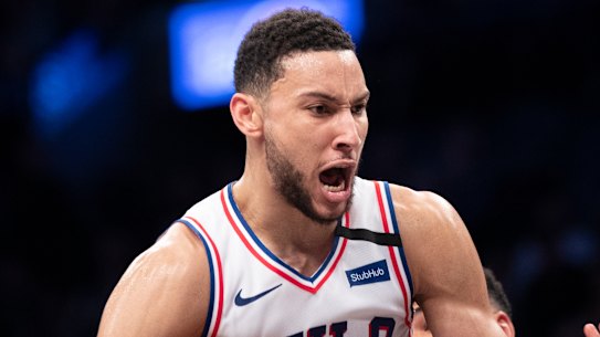 Ben Simmons grabs a rebound against the Nets.