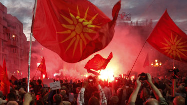 Opponents of the deal between Greece and Macedonia, on changing the country's new name to "North Macedonia", outside the parliament in Skopje, Macedonia in June.