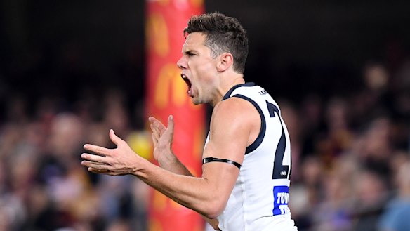 Josh Kelly celebrates after kicking a goal against the Brisbane Lions.