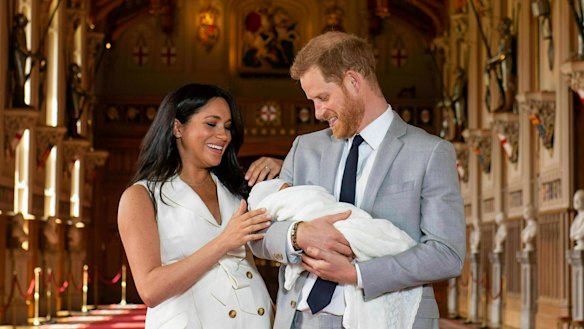 The Duke and Duchess of Sussex with newborn son Archie in St George’s Hall at Windsor Castle.