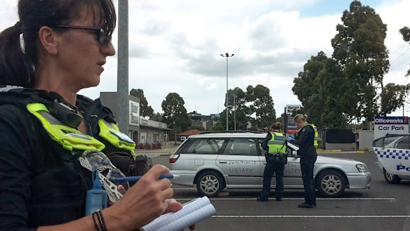 Victoria Police issue fines to protesters.