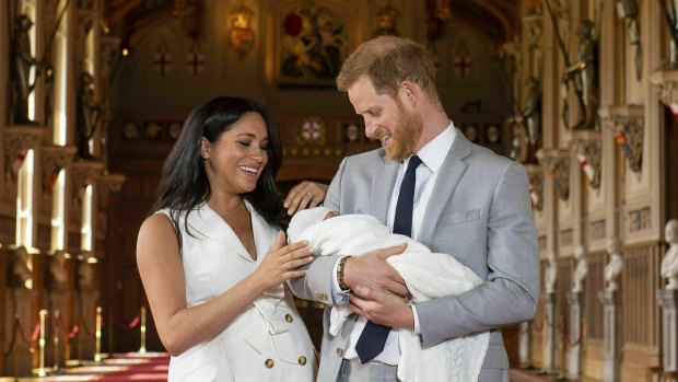 The Duke and Duchess of Sussex with newborn son Archie in St George’s Hall at Windsor Castle.