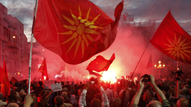 Opponents of the deal between Greece and Macedonia, on changing the country's new name to "North Macedonia", outside the parliament in Skopje, Macedonia in June.