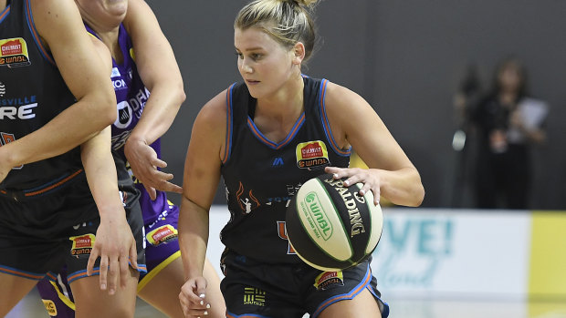 Shyla Heal drives to the basket during Townsville's WNBL win over the Melbourne Boomers on Sunday.