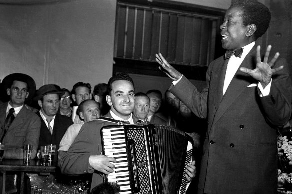 Vocalist Nellie Small and accordionist Gus Merzi perform at the Hotel Castlereagh on August 20, 1954. 