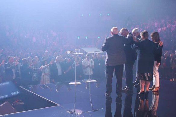 Australian Prime Minister Scott Morrison receives a blessing at the Australian Christian churches conference.