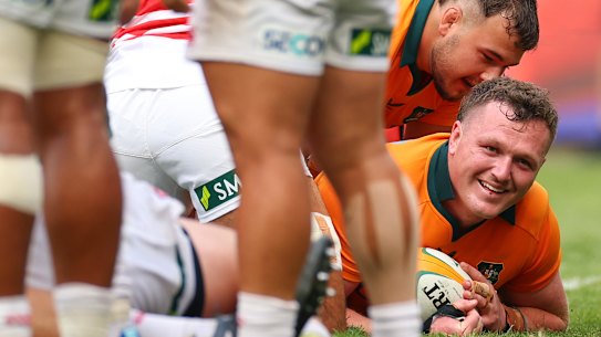 Angus Bell of the Wallabies scores a try.