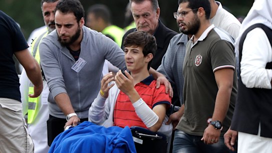 "I don't want to be here alone": Zahid Mustafa, in wheelchair, brother of Hamza and son of Khaled Mustafa killed  in the shooting. 