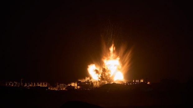 Smoke and fire rise to the sky following an Israeli airstrike in the northern Gaza Strip, as seen from southern Israel, on Thursday.
