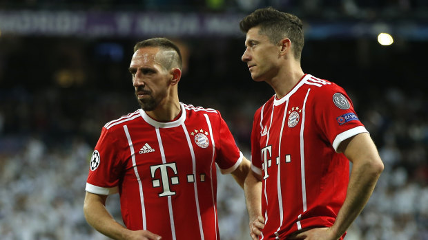 Down and out: Franck Ribery, left, and Robert Lewandowski at full time.