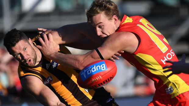 A Sun no more: Tom Lynch battles for the ball.