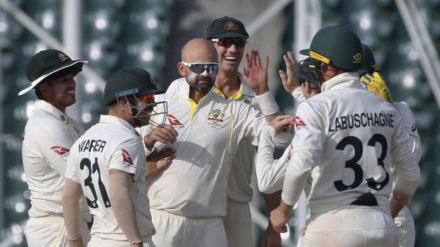 Nathan Lyon celebrates a wicket on Friday. 