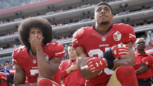 Colin Kaepernick and Eric Reid kneel during the national anthem in October 2016.