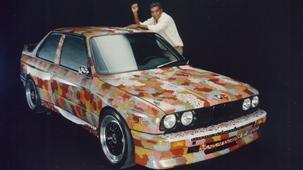 Kumantjayi Nelson Jagamara strikes a pose with his Art Car at the BMW studio.