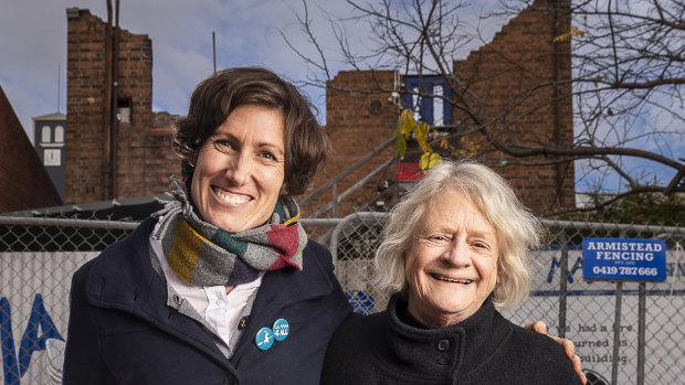 La Mama Theatre company manager Caitlin Dullard and artistic director Liz Jones outside the remains of the company's Faraday Street building shortly after it was lost in a fire.