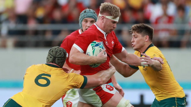 Wales' Aaron Wainwright is tackled by Pocock (left) and James O'Connor.