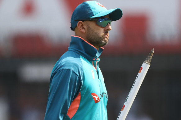 Nathan Lyon grabs a souvenir stump after setting up Australia’s victory with 11 wickets in the third Test.