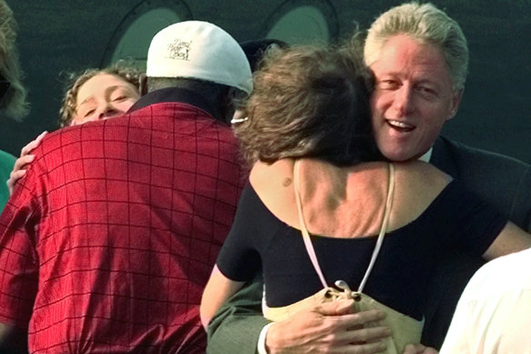 President Clinton hugs singer Carly Simon shortly after arriving at the Martha's Vineyard airport in 1998. 