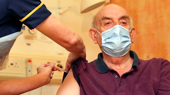 82-year-old Brian Pinker receives the Oxford University/AstraZeneca COVID-19 vaccine on January 4.
