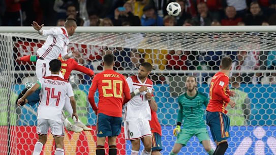 Spain snatch 2-2 draw with Morocco to top group