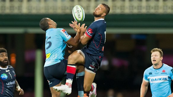 Bombs away: Kurtley Beale and Quade Cooper contest a high ball at the SCG.