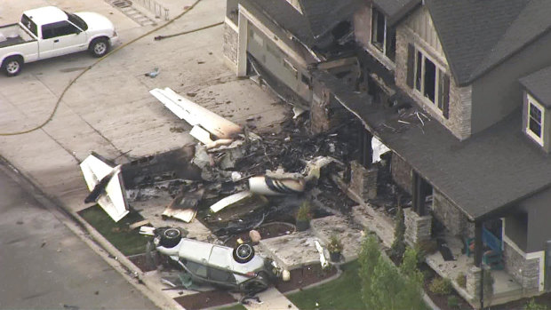 The small plane crashed into the front of the house. 