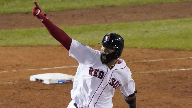 Biggest stage: Boston Red Sox's Eduardo Nunez rounds the bases after hitting a three-run homer.