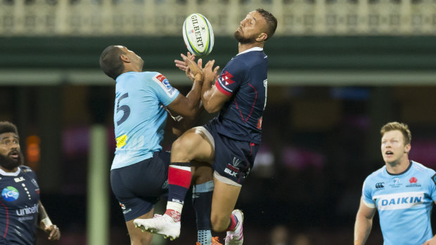 Bombs away: Kurtley Beale and Quade Cooper contest a high ball at the SCG.