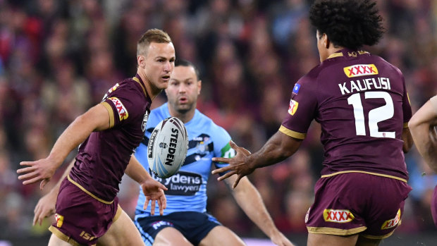 Pass master: Daly Cherry-Evans feeds Felise Kaufusi during a near flawless reurn in Queensland colours.