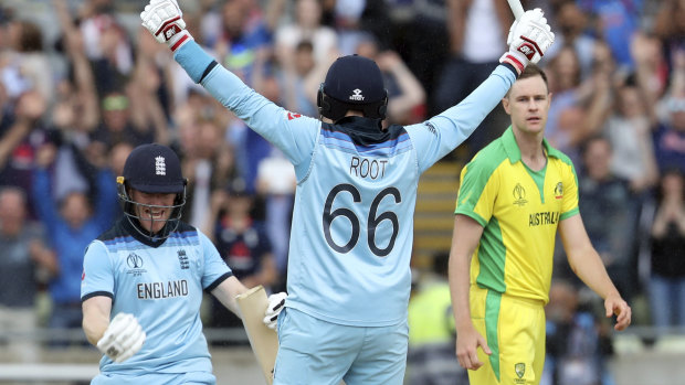England's captain Eoin Morgan, left, celebrates with teammate Joe Root after winning their semi-final.