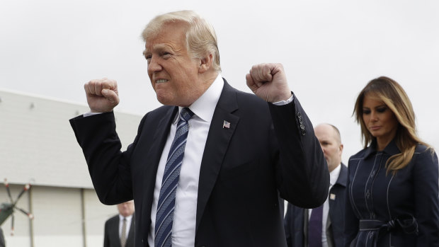 President Donald Trump greets people in Pennsylvania with a double fist pump.