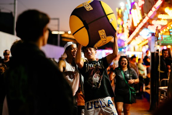Teenagers flock to Sideshow Alley as the night goes on.