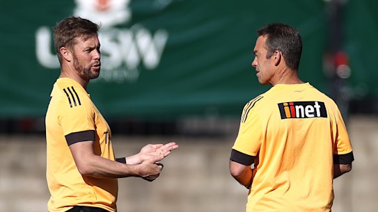 Former premiership Hawk Sam Mitchell with coach Alastair Clarkson.