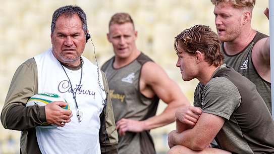 Dave Rennie speaks with captain Michael Hooper as Matt Philip watches on at training on Thursday. 